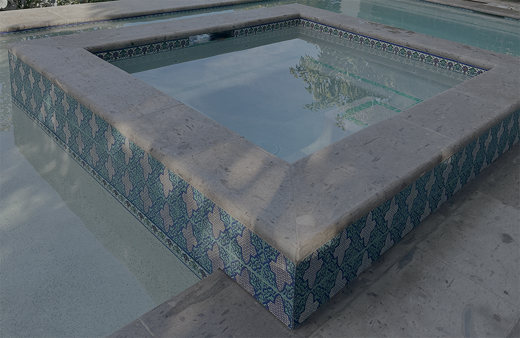 Talavera ceramic tiles, hand-painted blue and white patterns, glossy finish for pool water line applications Mexico.